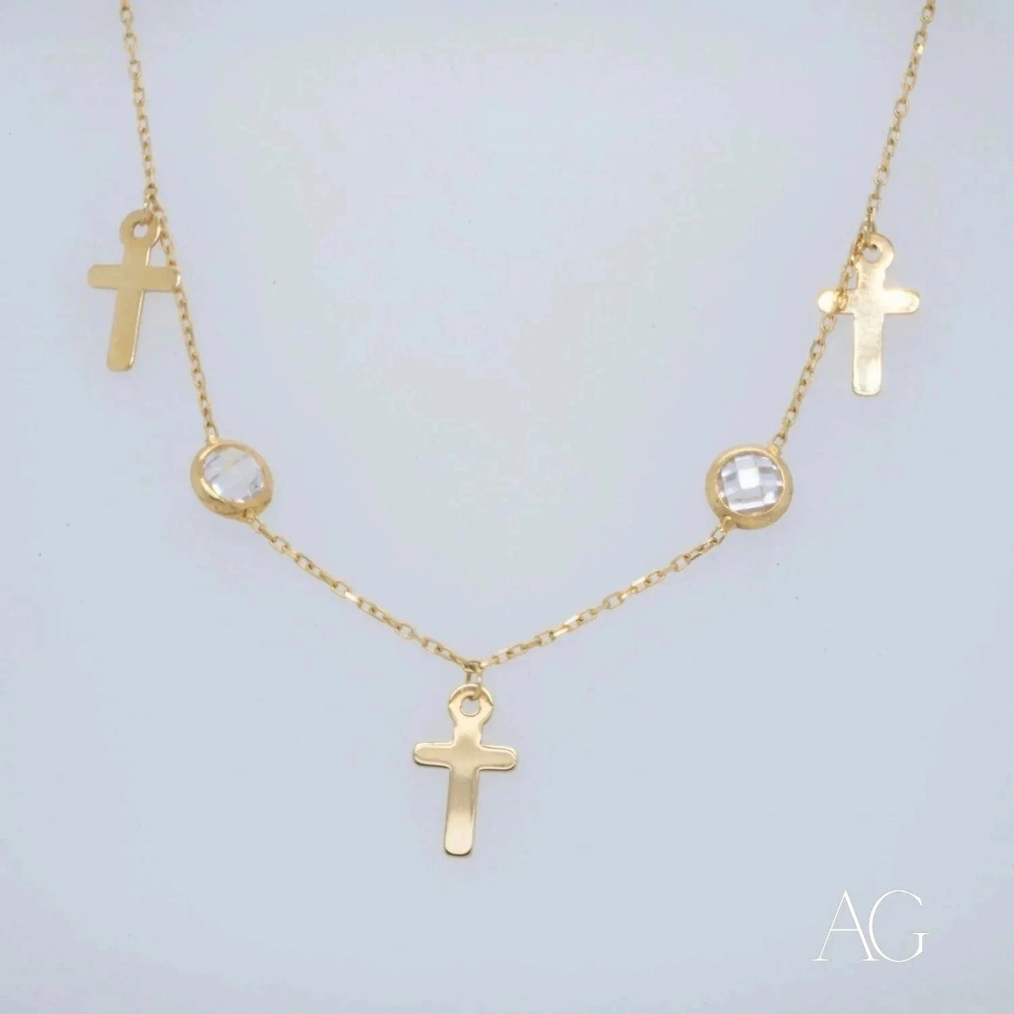 Gold jewelry featuring a gold necklace with crosses and crystal accents for Art Gold 18k charms anklet