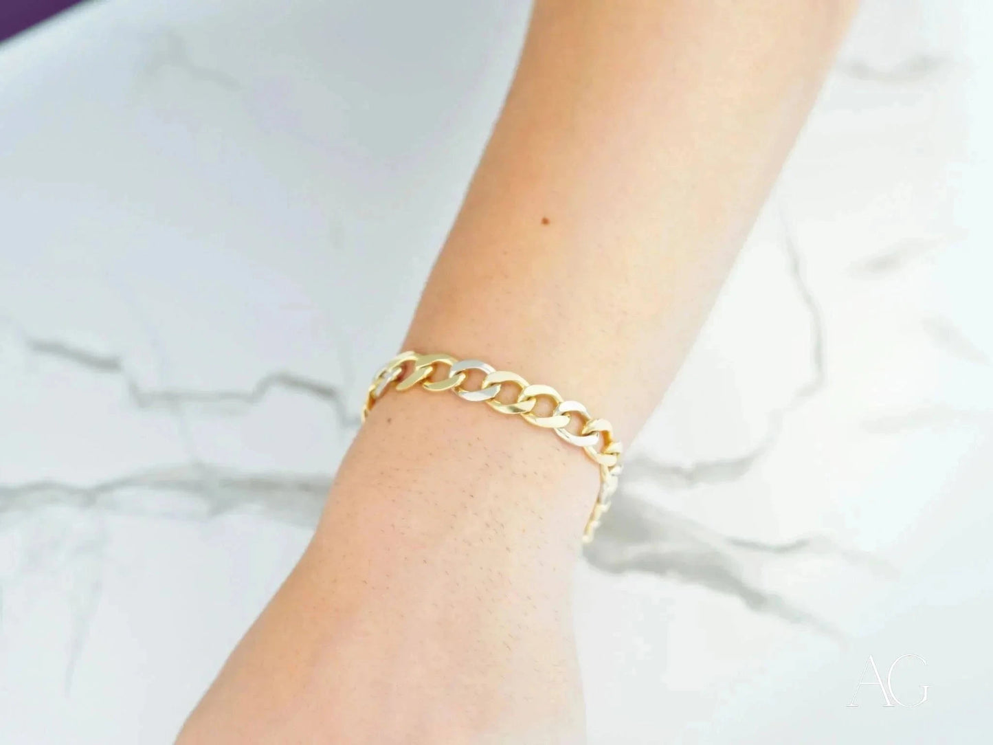 Gold chain bracelet on wrist showcasing art gold jewelry elegance and style