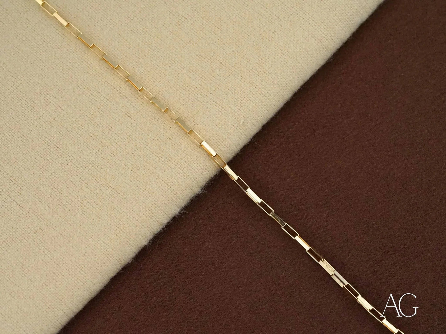 Delicate gold chain necklace with elongated links showcasing solid 18k gold elegance