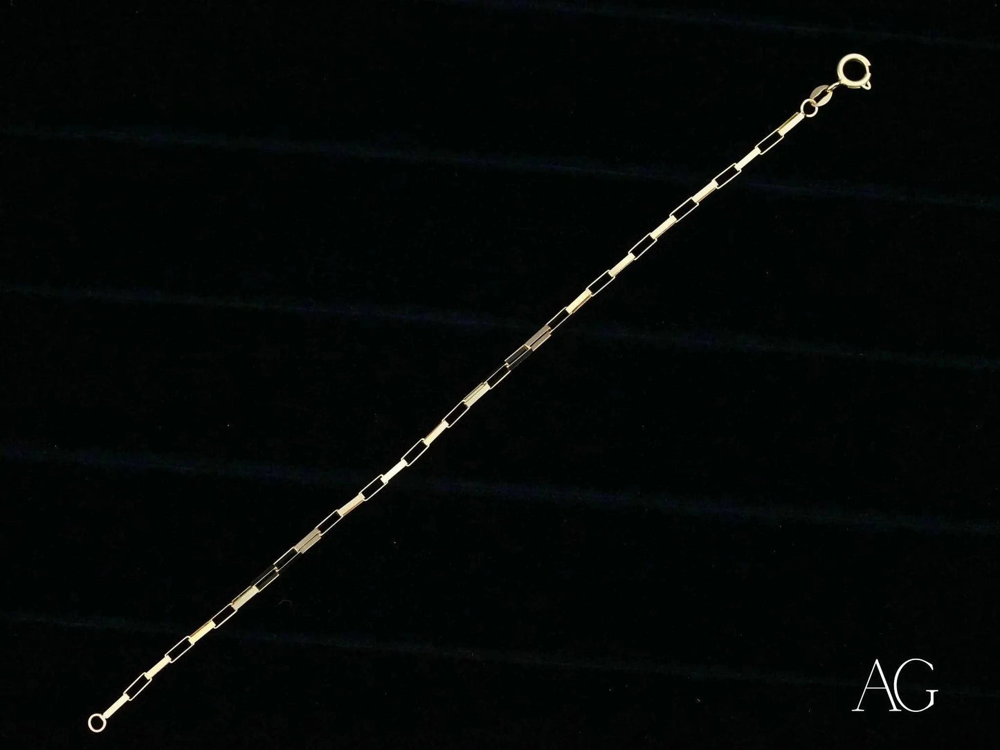 Delicate solid 18k gold brick link bracelet showcasing alternating bar links