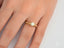 Gold Embrace of Light Engagement Ring featuring a center diamond in 18k gold prong setting