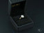 Diamond engagement ring in a black jewelry box showcasing Eternal Halo design in 18k gold