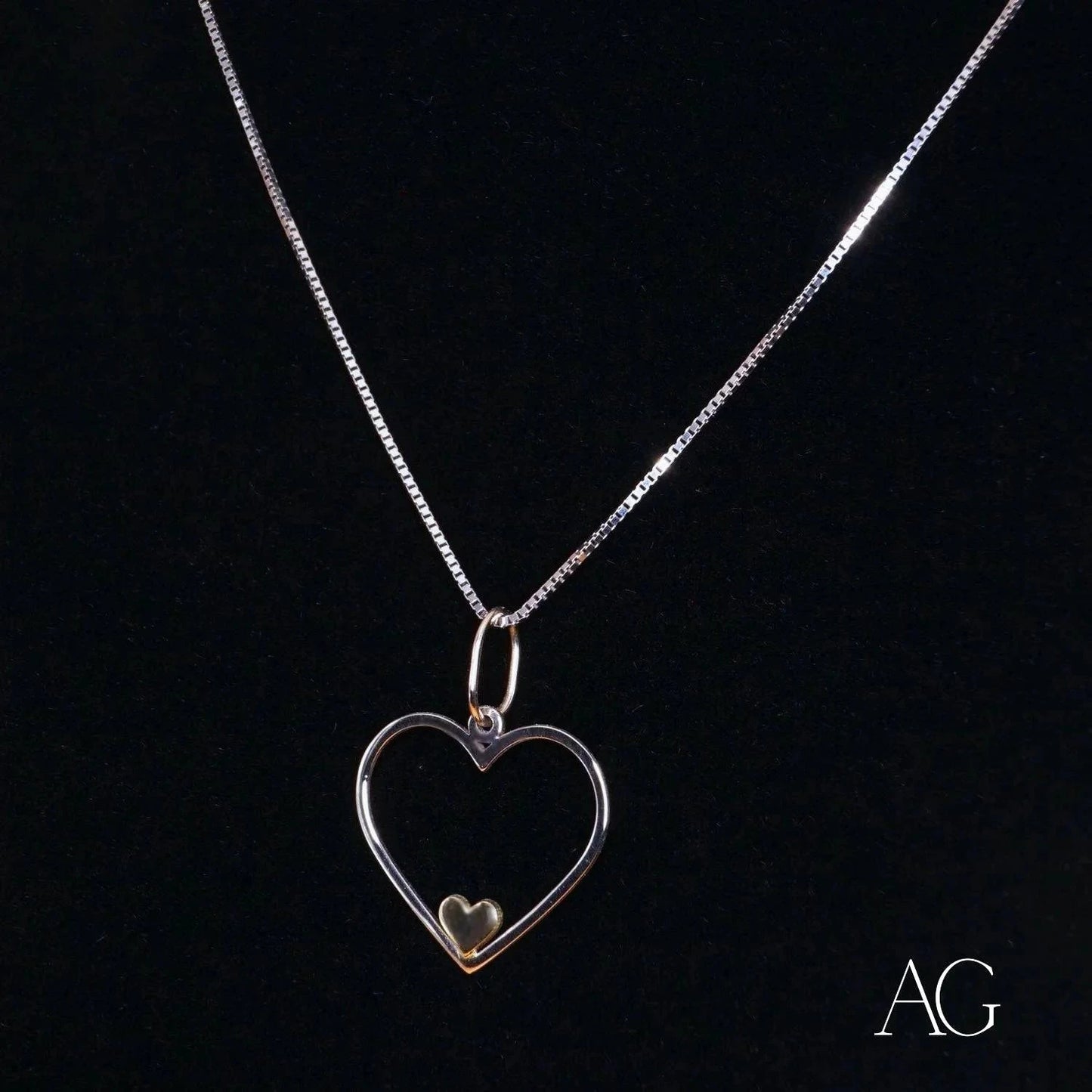 Heart-shaped silver pendant necklace with 14k gold accent, a true heartfelt glint pendant