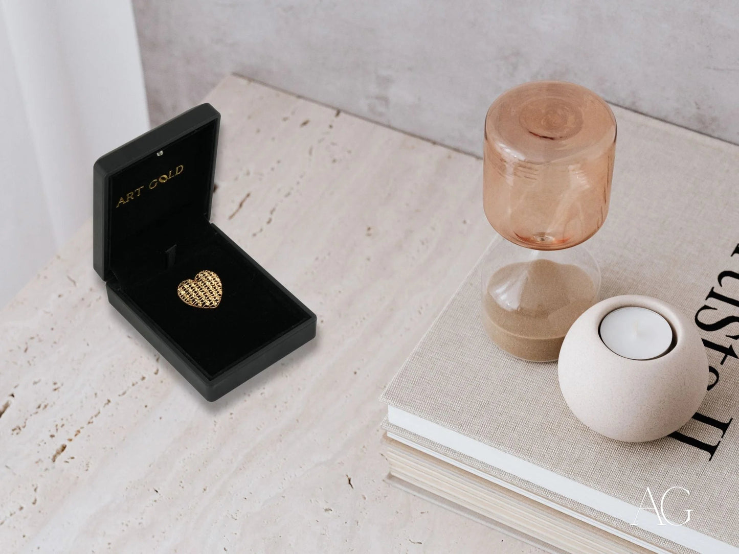 Black jewelry box with an 18k gold heart pendant showcasing a golden heart design