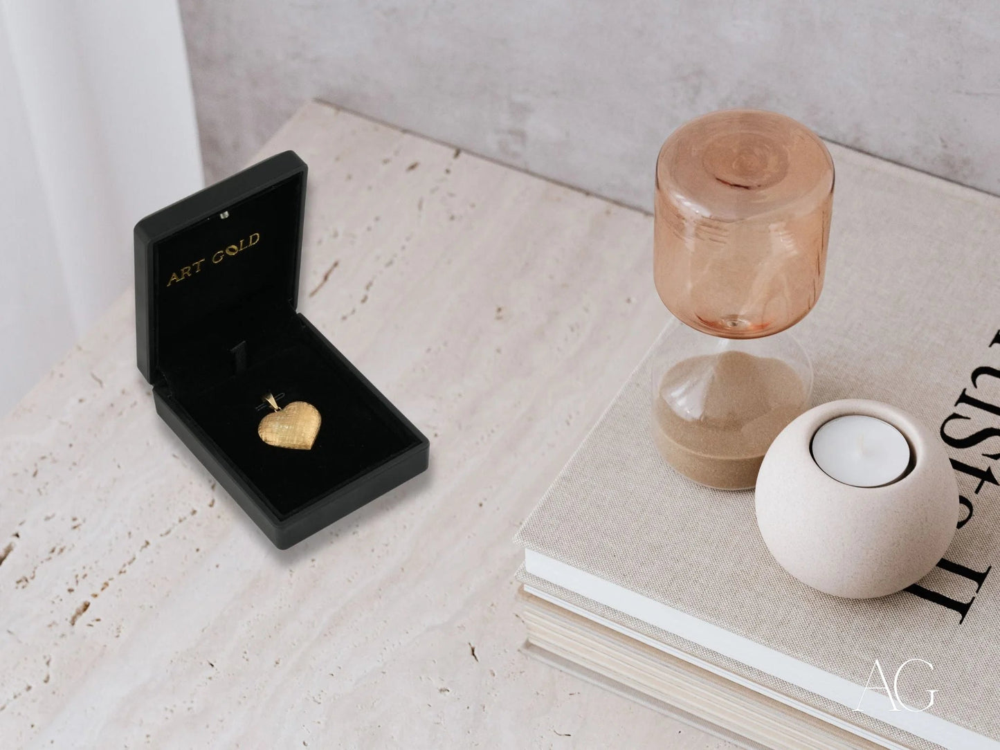 Gold heart pendant in a black velvet jewelry box, featuring 18k gold design