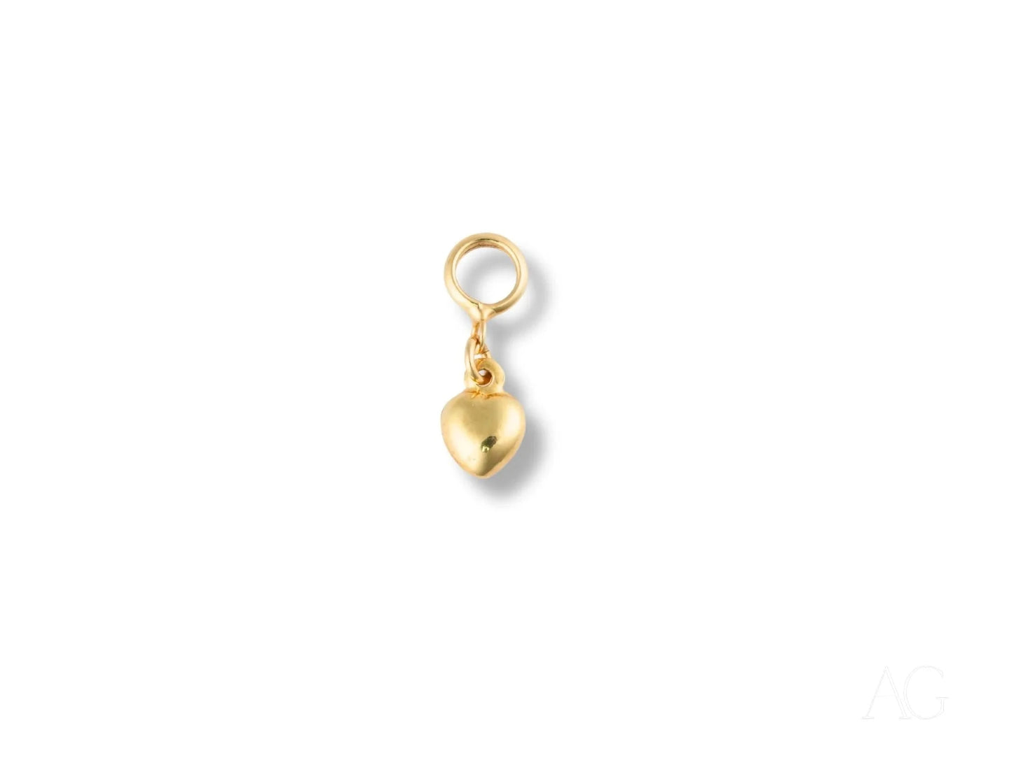 Golden heart charm pendant in 18k gold with loop attachment for jewelry design