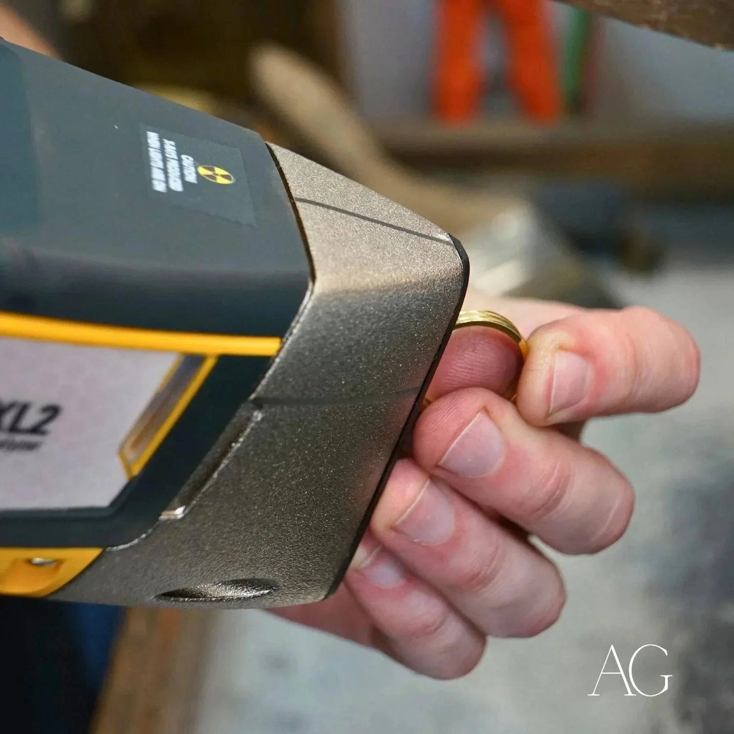 Handheld electronic device in yellow and black for art gold jewelry measurement