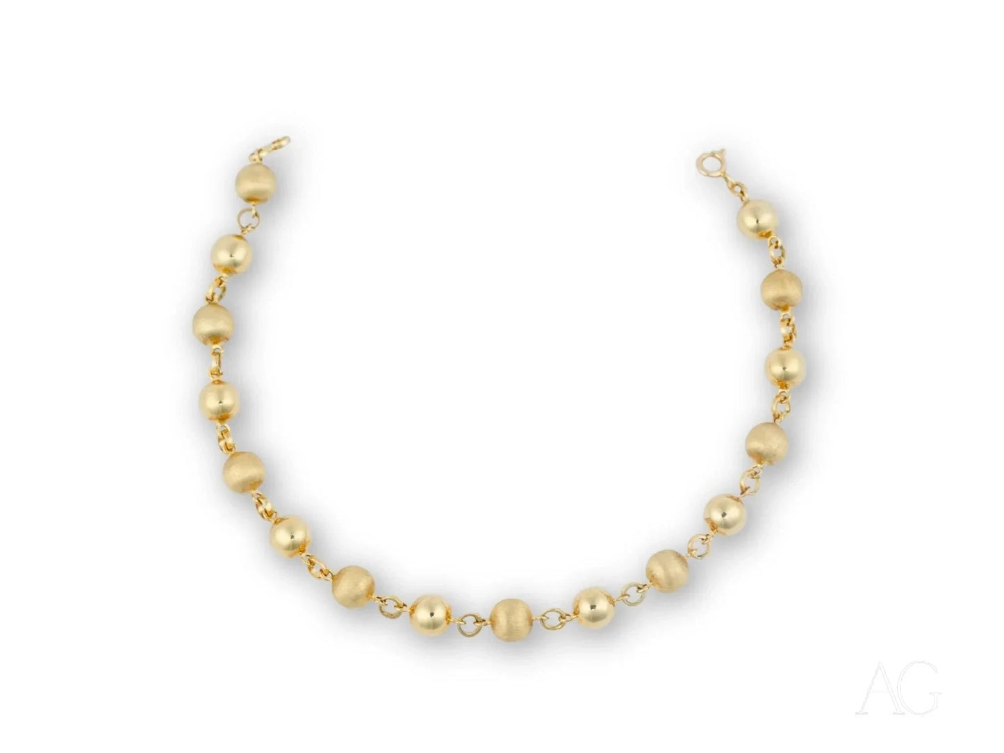 Women’s 18k solid gold bracelet with spring ring clasp and golden-hued pearl necklace