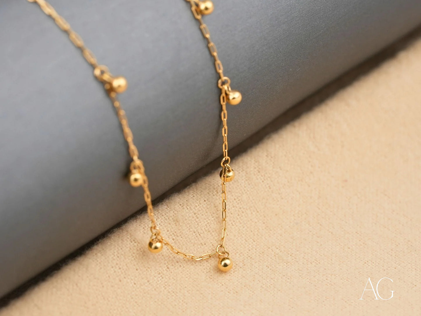 Elegant 18K Gold Beaded Necklace featuring dangling beads, part of Art Gold Jewelry