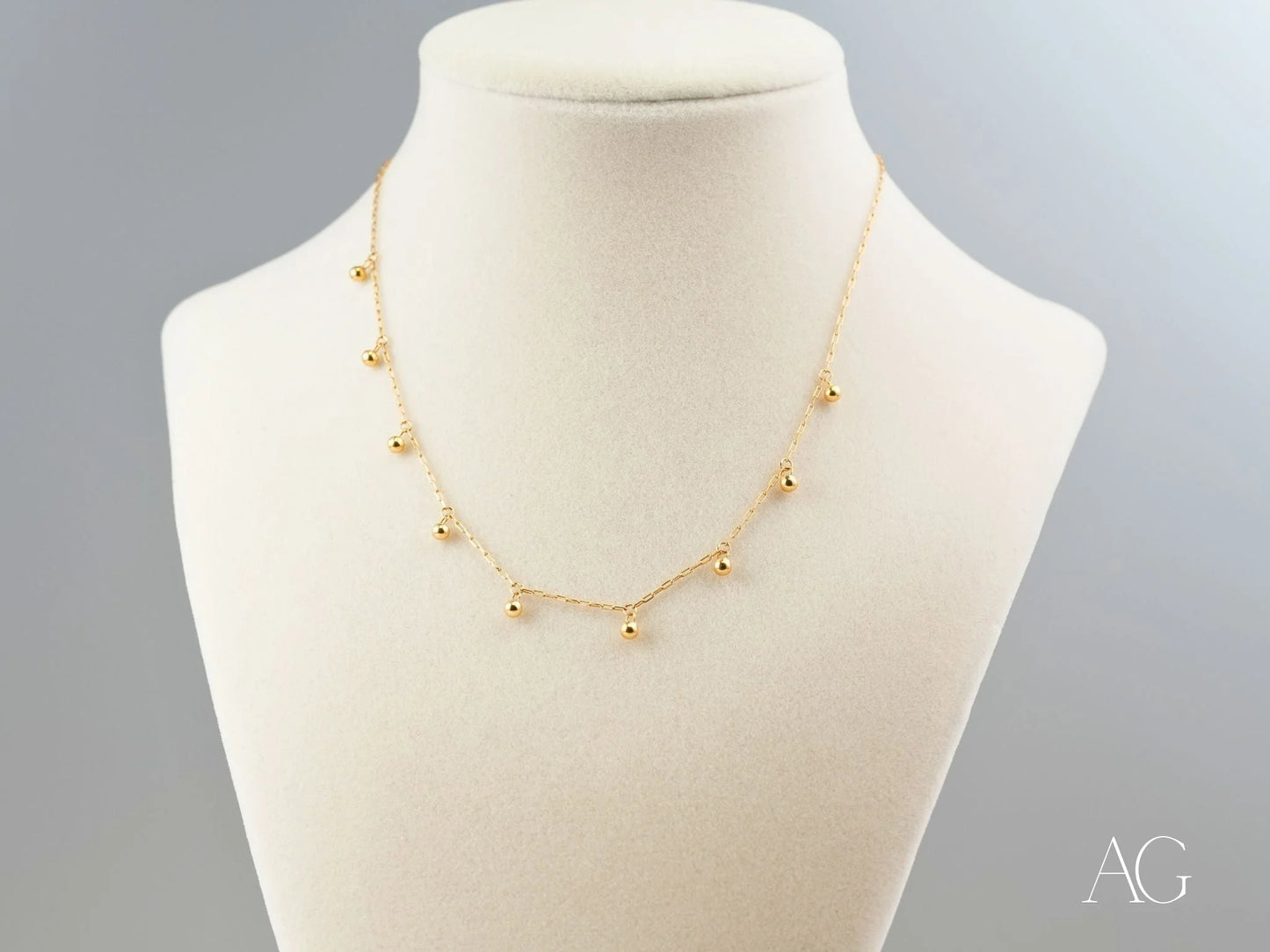 Elegant 18K Gold Beaded Necklace featuring dangling beads, perfect for art gold jewelry collection