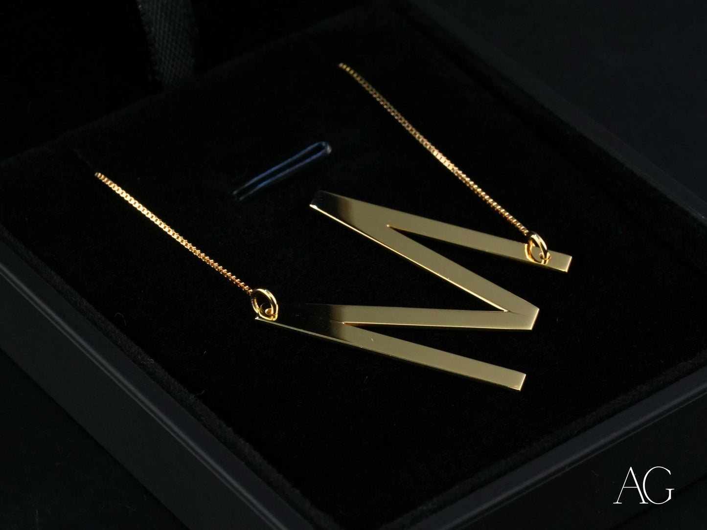 Gold initial letter pendant necklace featuring a personalized letter initial letter pendant with box chain