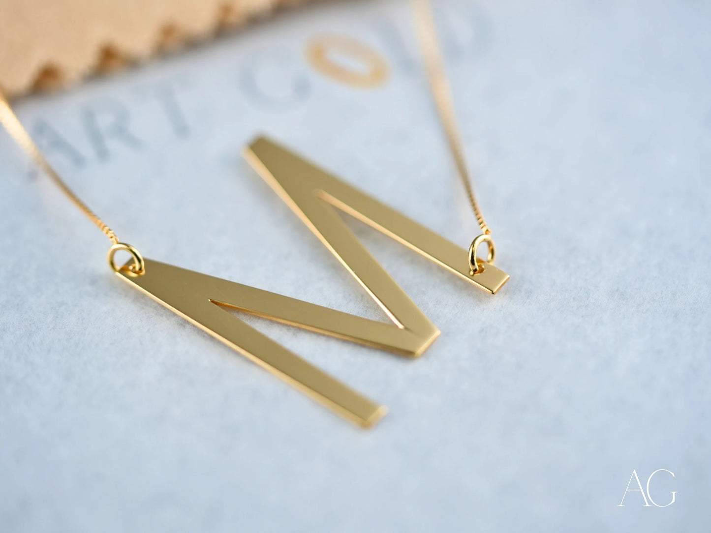Gold initial letter pendant necklace featuring personalized initial letter suitable for gifting