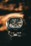 A cartier watch is displayed in close-up.