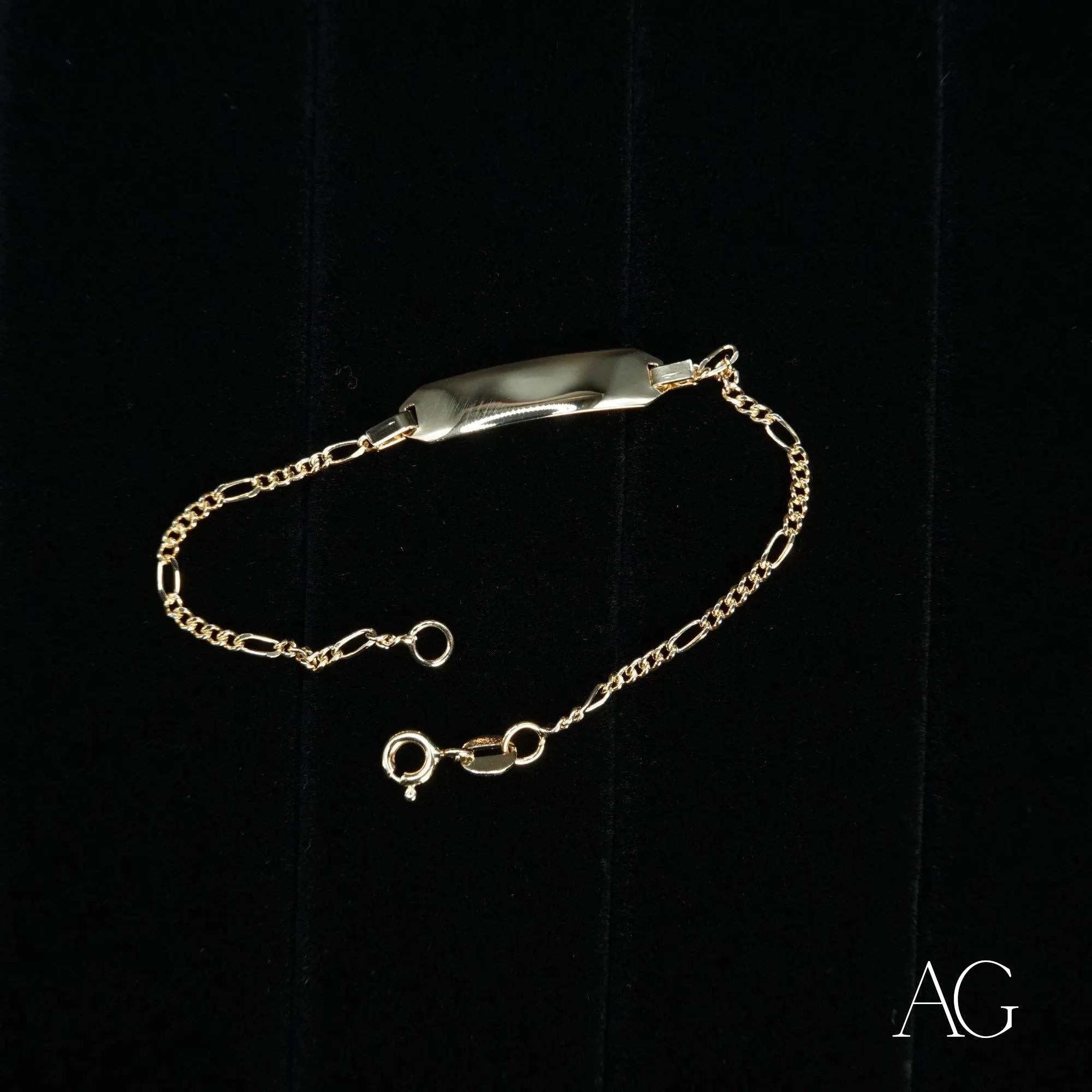 Gold chain bracelet with engraved plate featuring 18k gold personalized ID bracelet timeless elegance