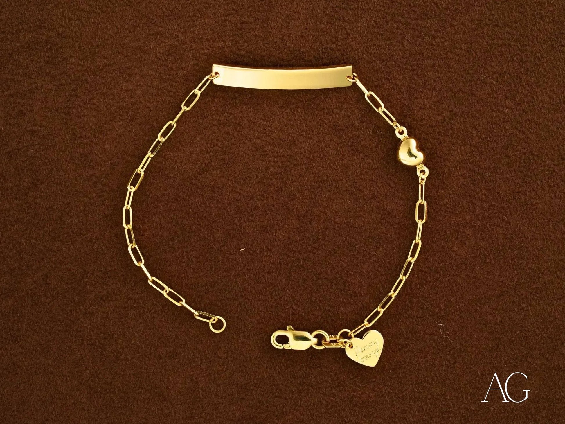 Solid 18k gold kid’s bracelet with bar and heart charm custom ID plate