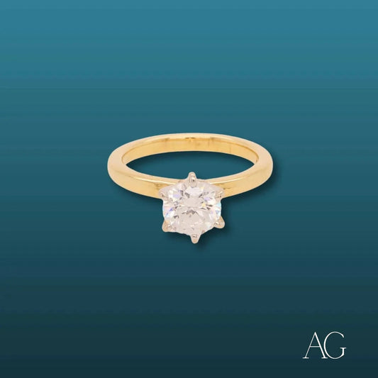 Gold engagement ring featuring a solitaire diamond in a six-prong setting, 18k CZ solitaire