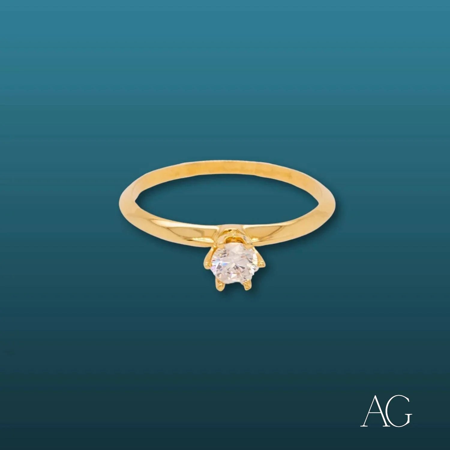 Gold engagement ring featuring a single round diamond in an 18k CZ solitaire design