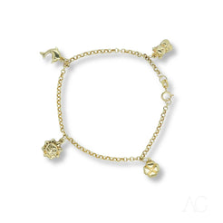 18k gold charm bracelet for kids featuring four dangling charms in elegant design