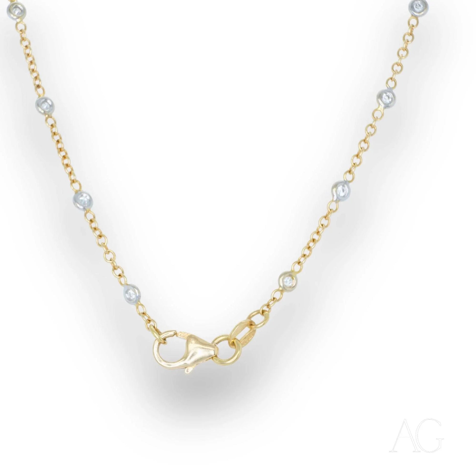 Delicate 18k gold diamond anklet featuring small clear gemstones along its length