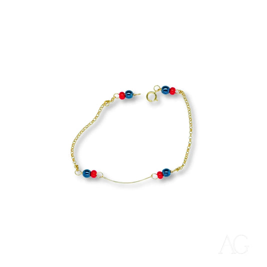Delicate 18k gold kids’ bracelet featuring black coral and heart symbol beads