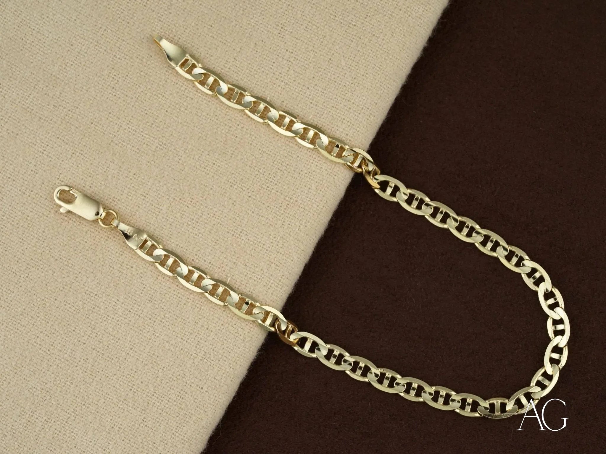 Gold chain necklace with interlocking links from an 18k solid gold bracelet with navy link pattern