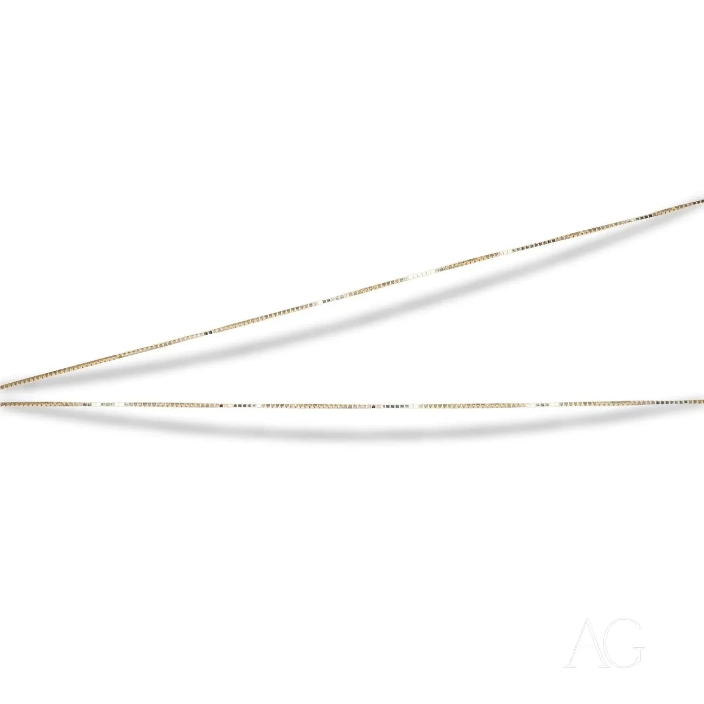 Two delicate 14k gold slim needles showcased with a 14k gold box chain
