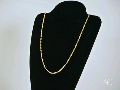 Elegant 14k gold rope chain necklace with secure barrel lock on a black jewelry bust