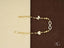 Delicate 18k gold bracelet with infinity symbol and heart charm, adorned with cubic zirconia