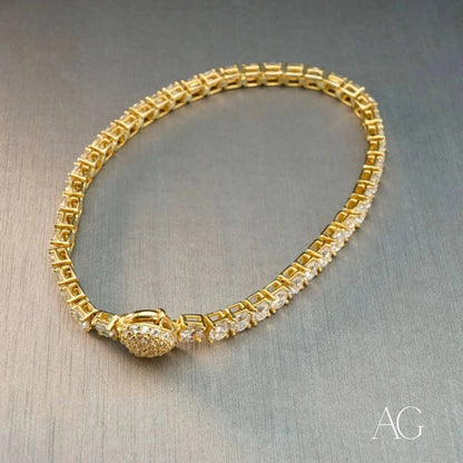 Elegant Zirconia Tennis Bracelet featuring a gold design with diamond accents and clasp