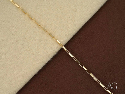 Delicate gold chain necklace with elongated links showcasing solid 18k gold elegance