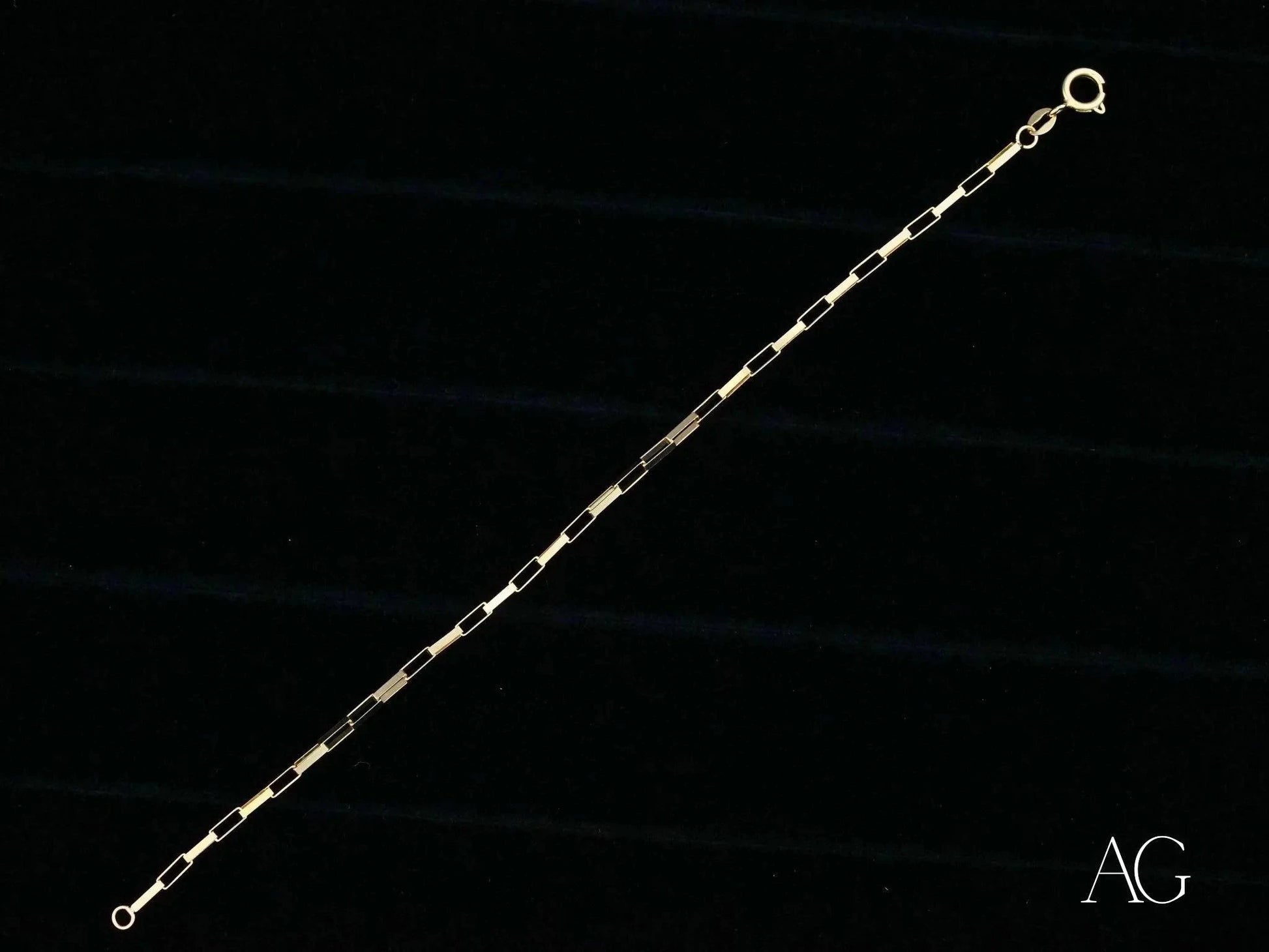 Delicate solid 18k gold brick link bracelet showcasing alternating bar links