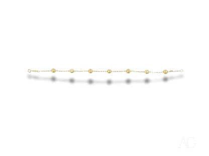 Elegant women’s 18k gold bracelet with spring ring clasp and delicate round beads