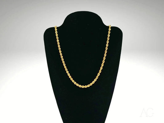 Elegant 18k gold rope chain necklace on a black velvet jewelry stand