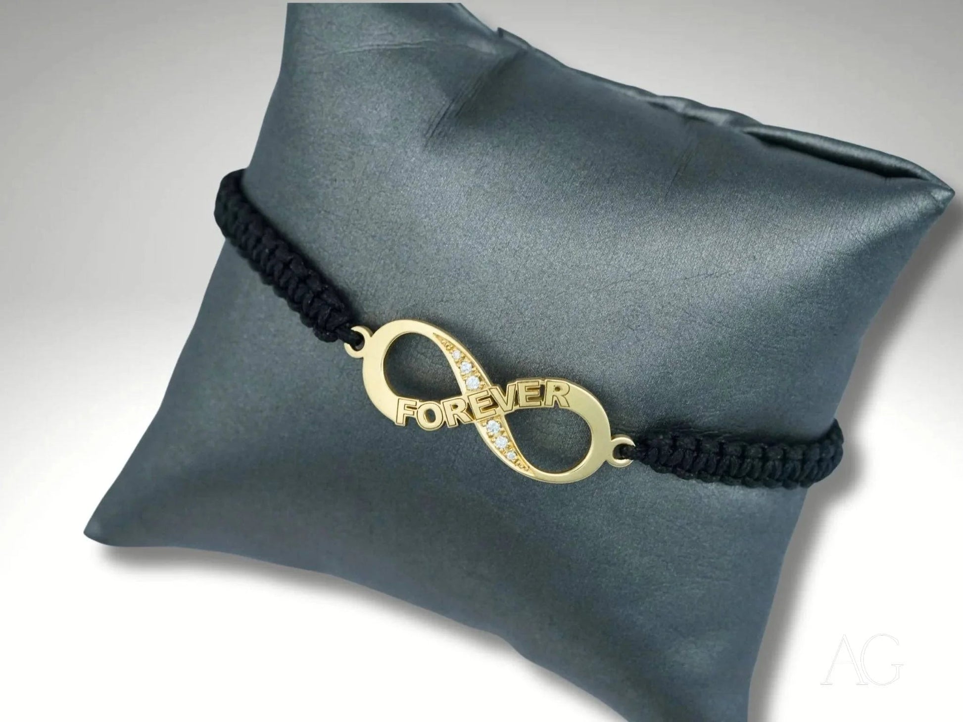 Bracelet featuring an 18k gold infinity charm on a durable nylon band