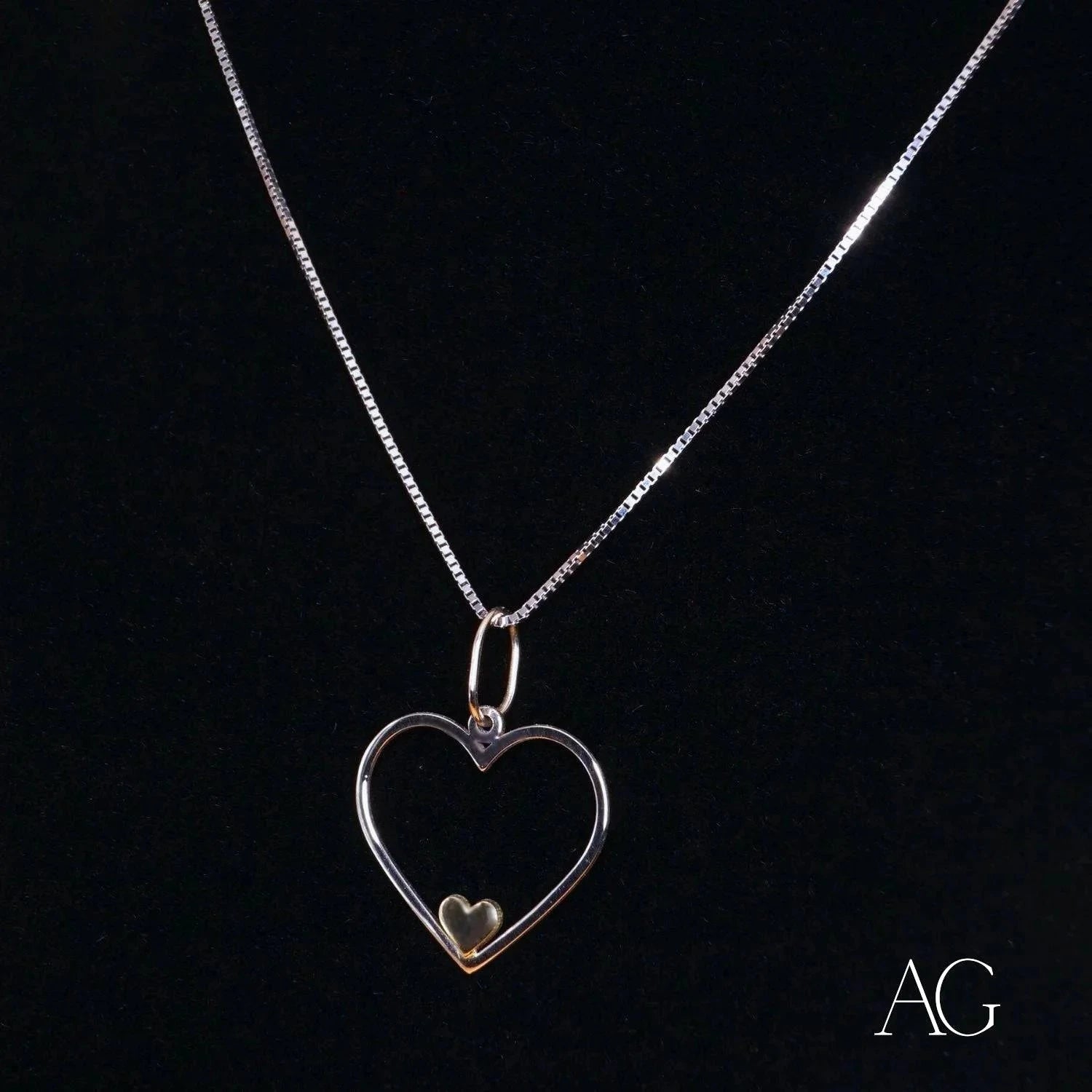 Heart-shaped silver pendant necklace with 14k gold accent, a true heartfelt glint pendant