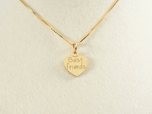Gold heart-shaped pendant engraved Best Friends on delicate 18k gold chain necklace