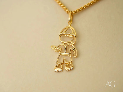 Gold pendant necklace featuring stick figure boy in hat from Golden Cherish collection