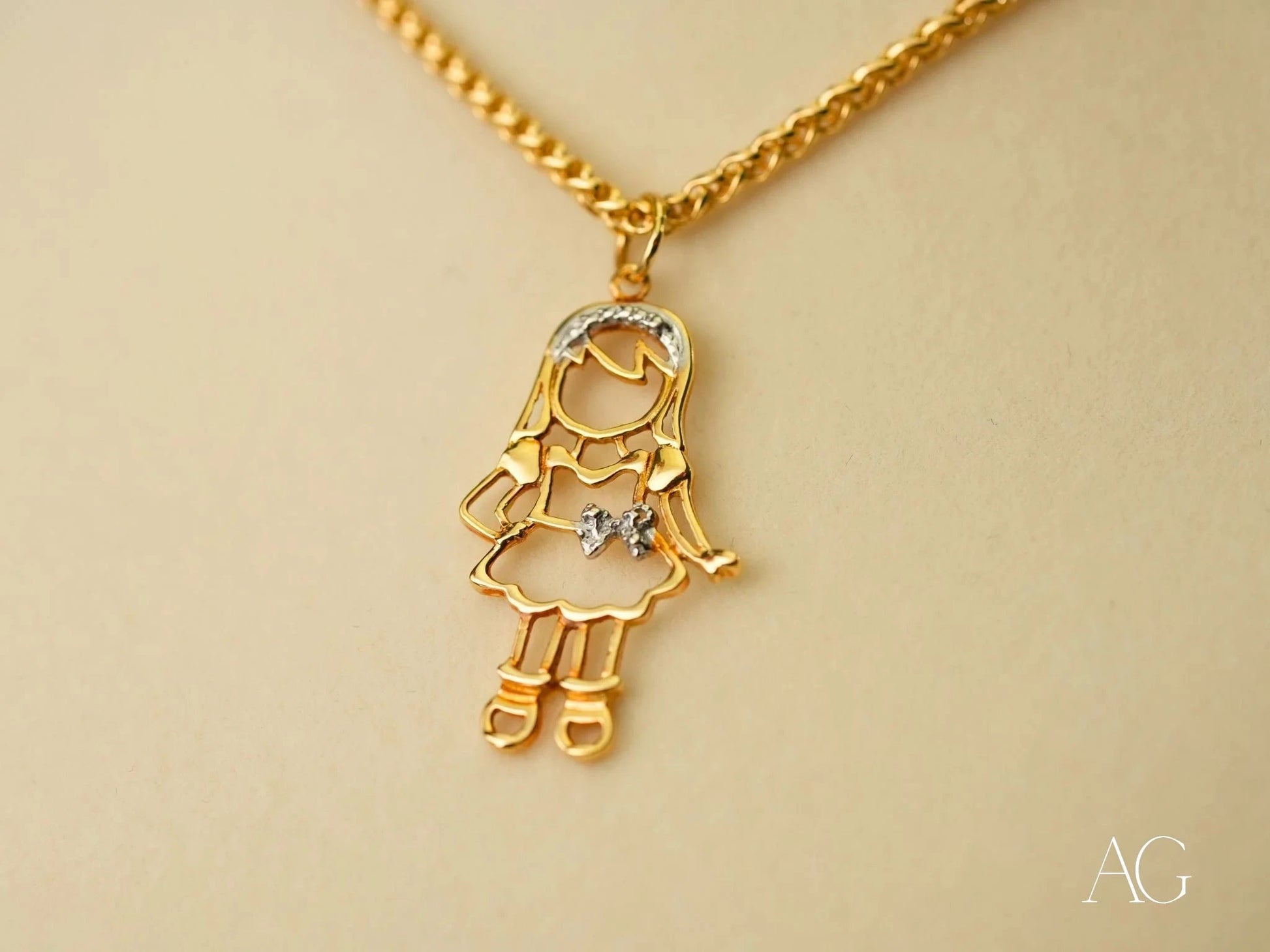 Gold pendant necklace with stick figure girl design and crystal accent from Golden Cherish