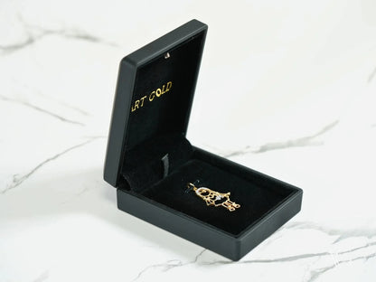 Black jewelry box showcasing a stunning 18k gold Golden Cherish pendant ring
