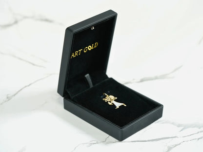 Black jewelry box featuring a Golden Elegance pendant in 18K gold