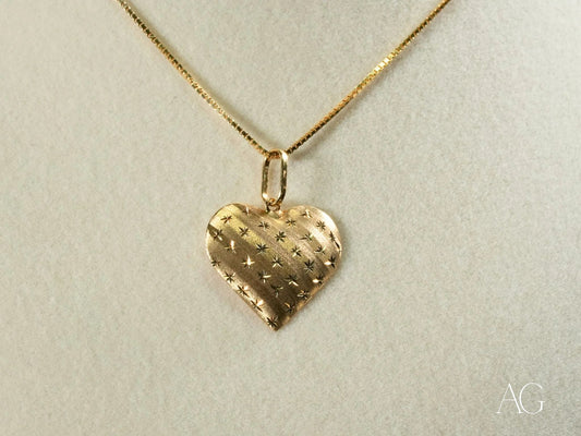 18k gold golden heart pendant with textured pattern on a stylish chain necklace