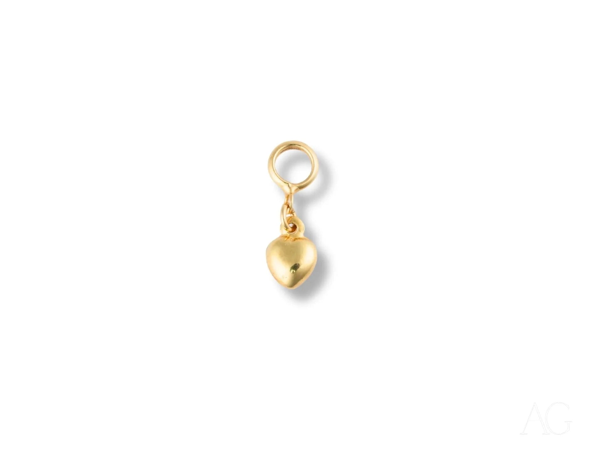 Golden heart charm pendant in 18k gold with loop attachment for jewelry design