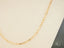 Gold rectangular link chain from the Golden Icon 18K Yellow Gold Paperclip Link Chain
