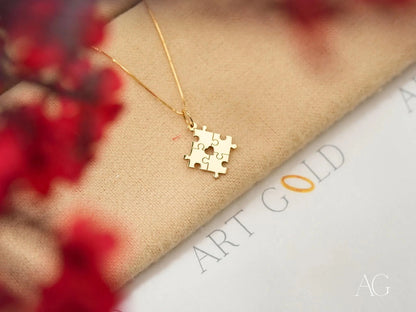 Gold puzzle piece pendant necklace for Autism Awareness featuring a golden puzzle design