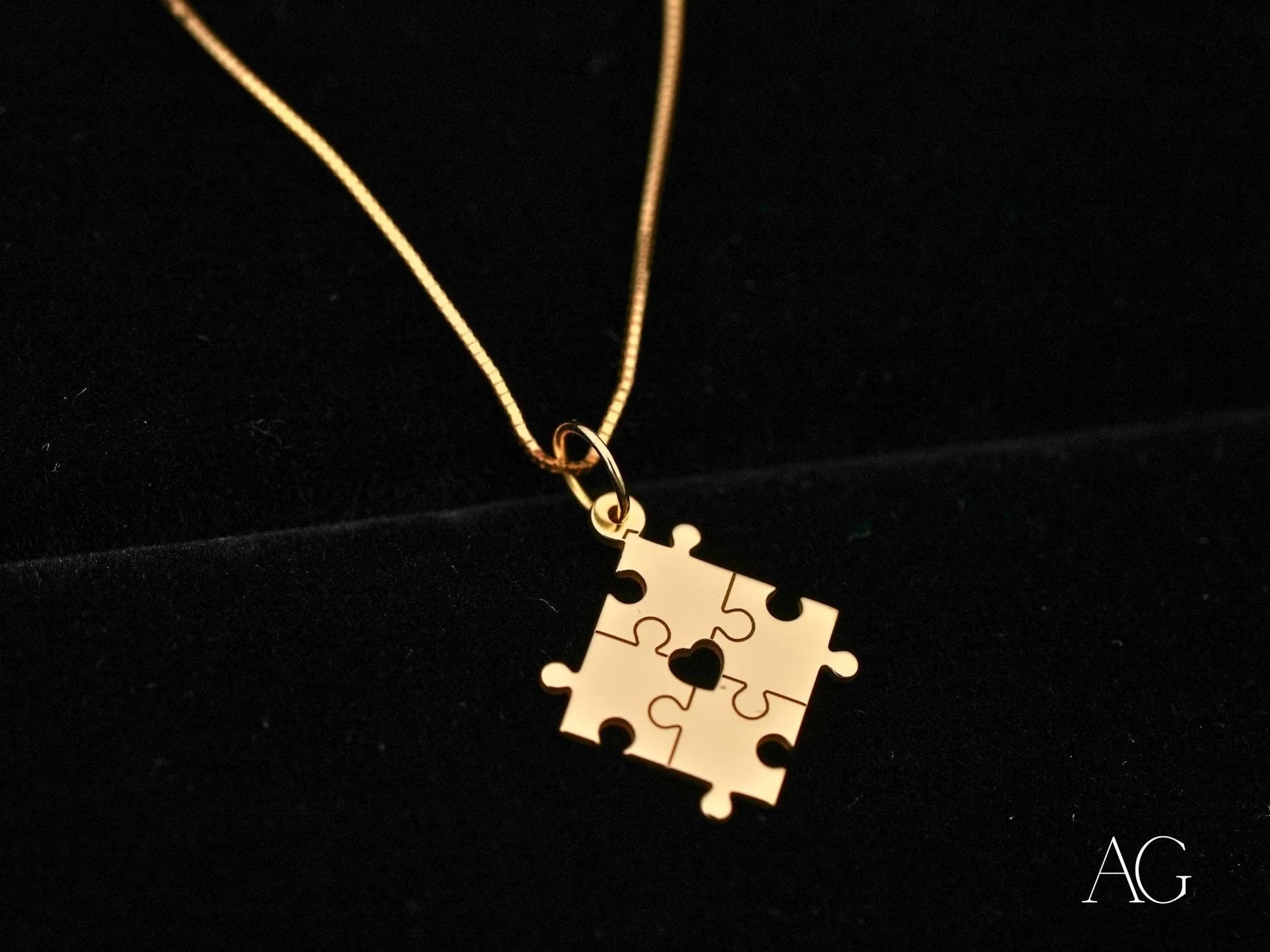 Gold puzzle piece pendant necklace for autism awareness in a stylish golden puzzle design
