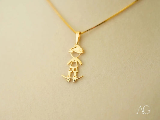 Gold pendant necklace featuring a skateboarding boy charm in 18k gold, Golden Skater