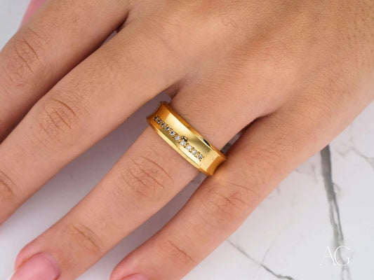 Gold Luminous Path Wedding Band in 14k gold with engraved text on a finger
