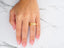 Gold 14k Wedding Band with engraved text on a finger, Luminous Path design