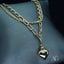 Luxurious 18k double chain anklet with heart charm, showcasing elegant craftsmanship and modern design.