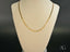 Gold mariner link chain from the Refined Prestige 18K Gold Piastrine collection